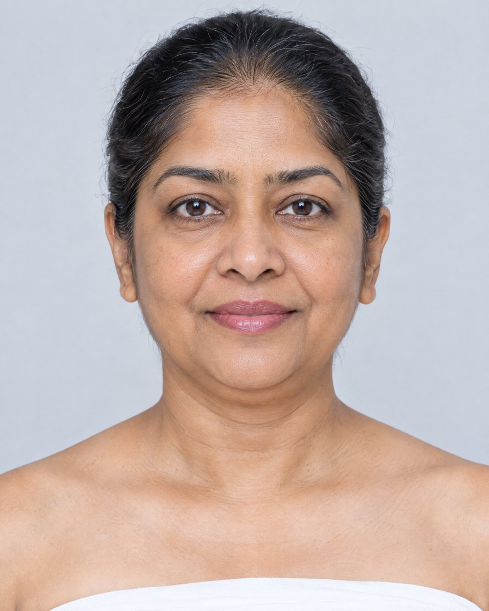Illustration of a woman's face, front view, used as a map of facial areas
